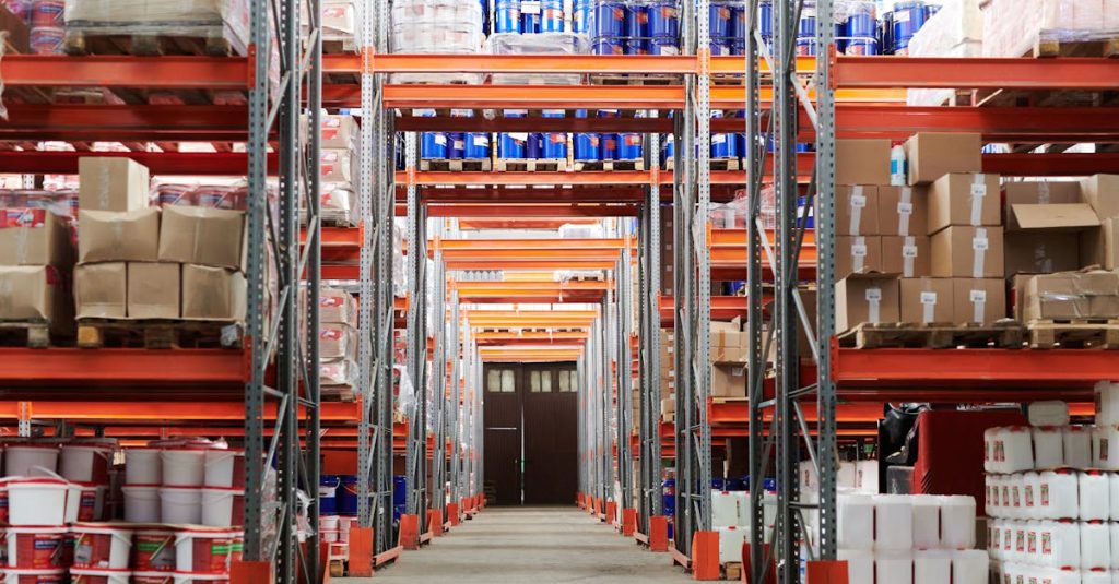 Third party logistics - Wide angle view of a warehouse with stocked shelves and boxes.